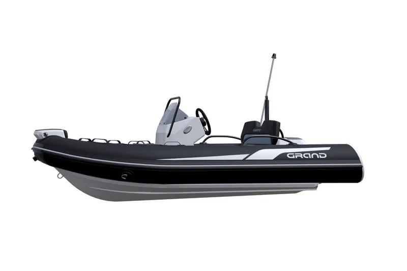 Slide: The Image of 2026 Grand Inflatables G380N boat, sleek black design, side view. - 11