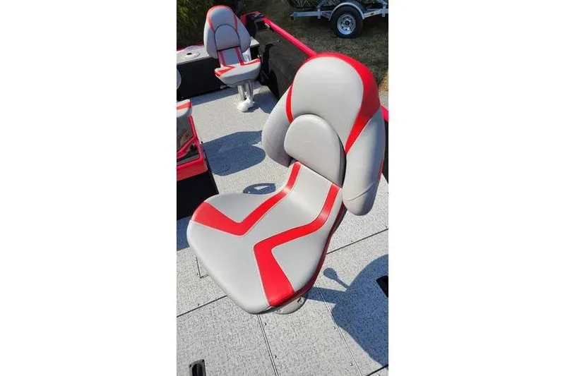 Slide: The Image of 2026 Smoker Craft Lazer 161 boat seat with red and gray design. - 6