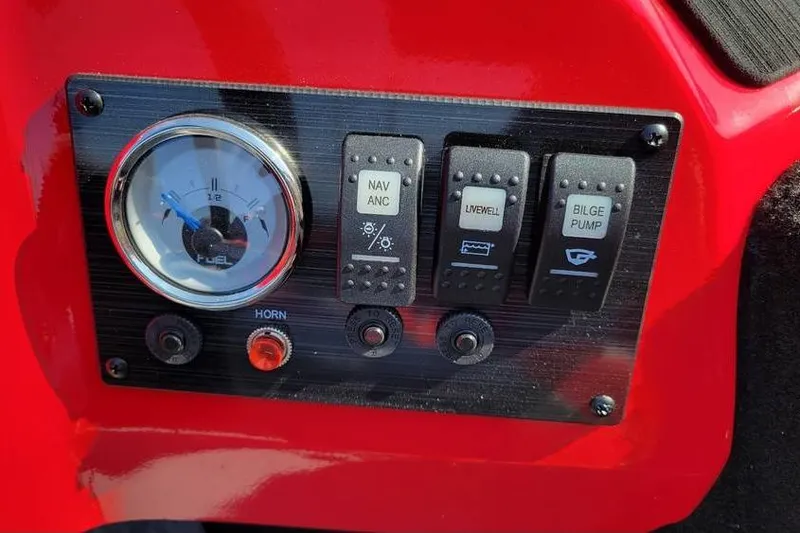 Slide: The Image of Control panel of 2026 Smoker Craft Lazer 161 boat with fuel gauge and switches. - 8