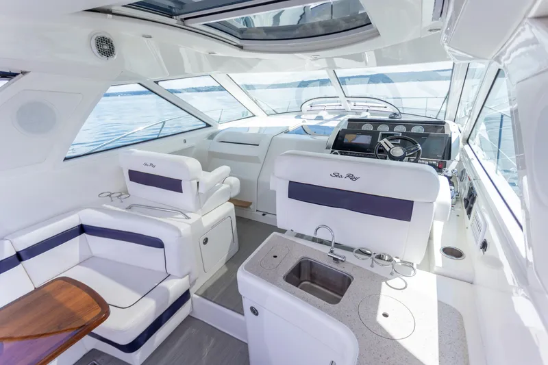Slide: The Image of Luxurious interior of 2011 Sea Ray 450 Sundancer yacht with modern helm and seating. - 11
