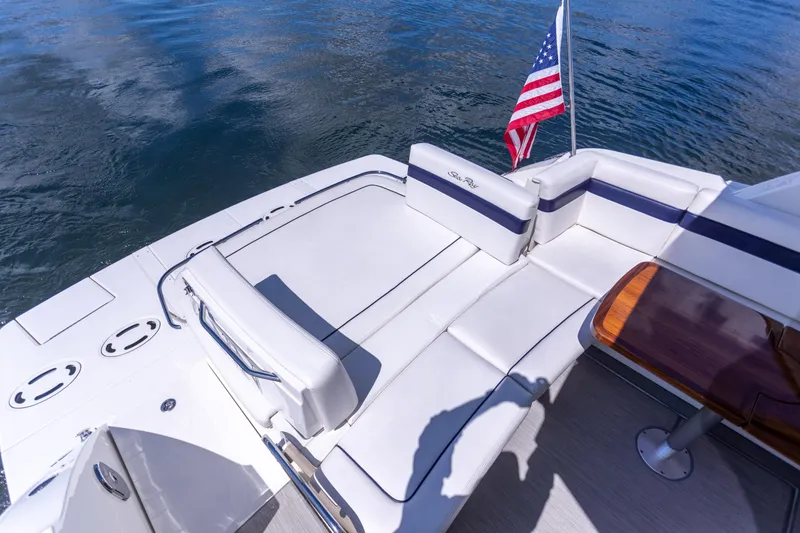 Slide: The Image of 2011 Sea Ray 450 Sundancer yacht deck with seating and American flag. - 16