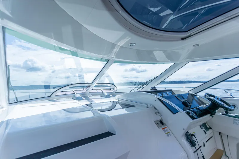 Slide: The Image of Interior view of 2011 Sea Ray 450 Sundancer yacht cockpit with ocean backdrop. - 22