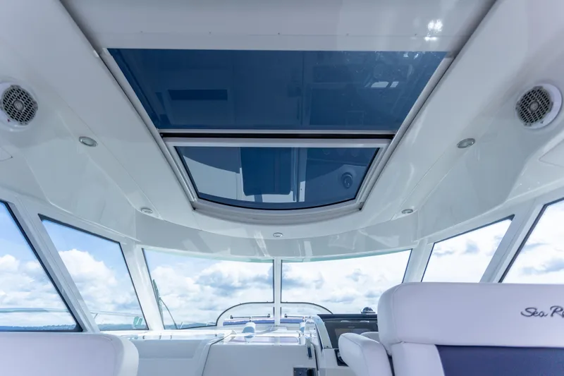 Slide: The Image of Interior view of 2011 Sea Ray 450 Sundancer yacht with panoramic windows and sleek design. - 23