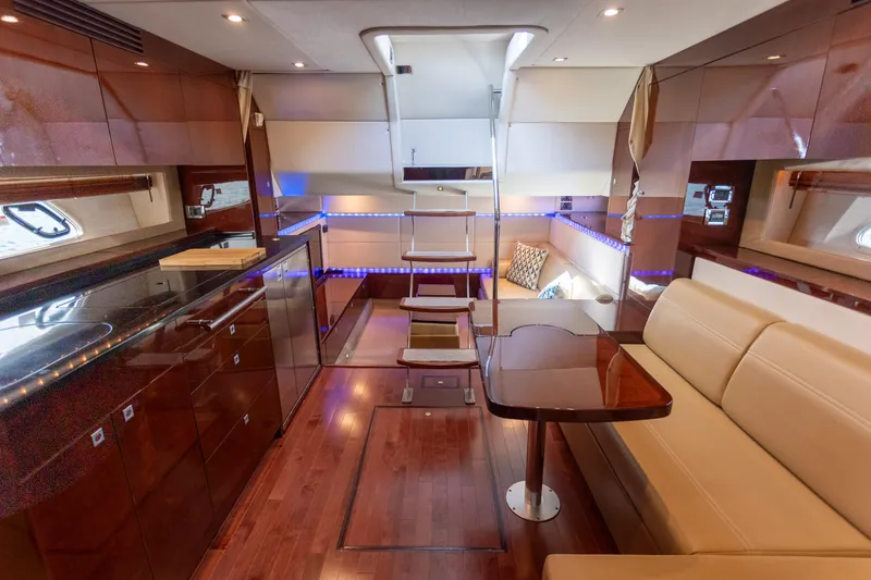 Slide: The Image of Luxurious interior of 2011 Sea Ray 450 Sundancer yacht with elegant wood finishes. - 25
