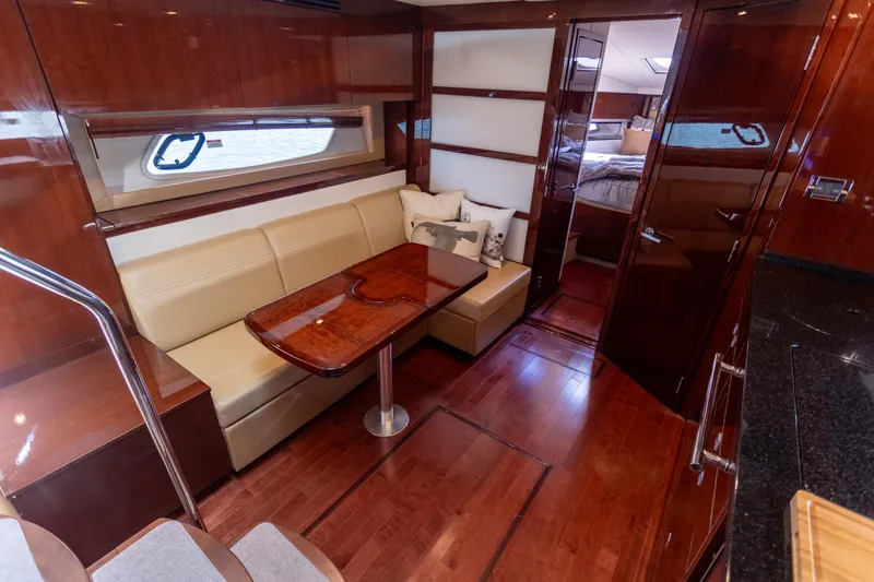 Slide: The Image of Luxurious interior of 2011 Sea Ray 450 Sundancer yacht with elegant wood finishes. - 26