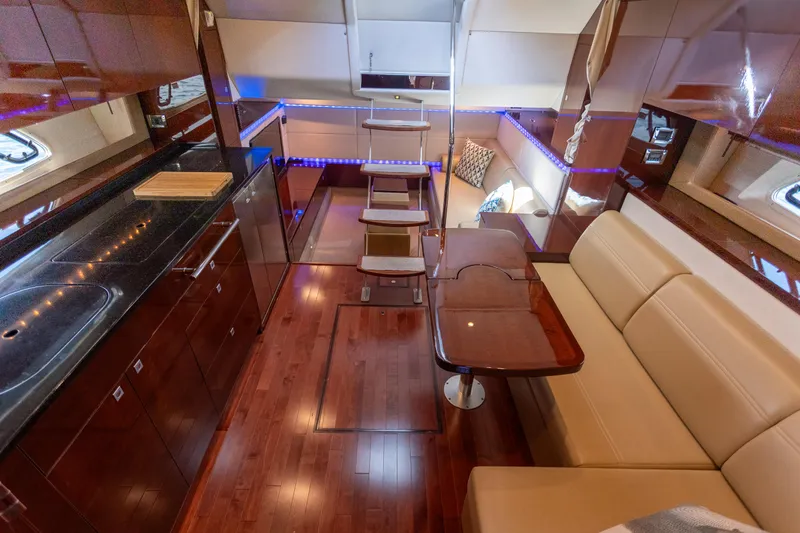 Slide: The Image of Luxurious interior of 2011 Sea Ray 450 Sundancer yacht with elegant wood finishes. - 27