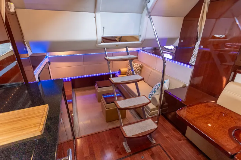Slide: The Image of Luxurious interior of 2011 Sea Ray 450 Sundancer yacht with modern design and ambient lighting. - 28