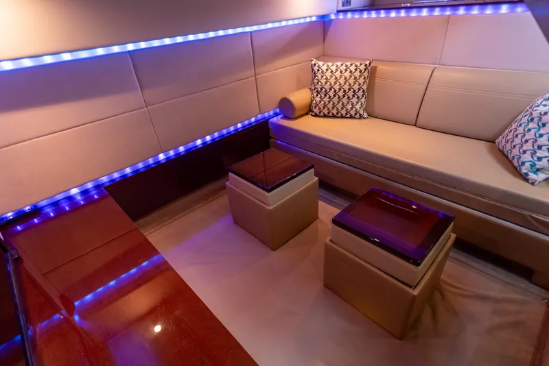Slide: The Image of Luxurious interior of 2011 Sea Ray 450 Sundancer with modern seating and ambient lighting. - 35