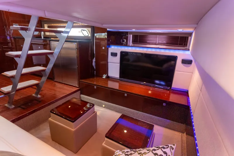 Slide: The Image of Luxurious interior of 2011 Sea Ray 450 Sundancer yacht with modern entertainment area. - 36