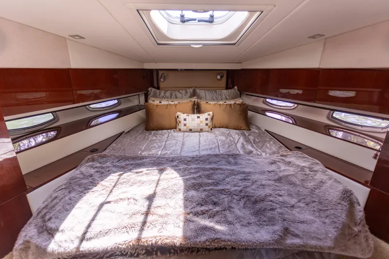 Slide: The Image of Luxurious cabin interior of 2011 Sea Ray 450 Sundancer yacht with plush bedding. - 37