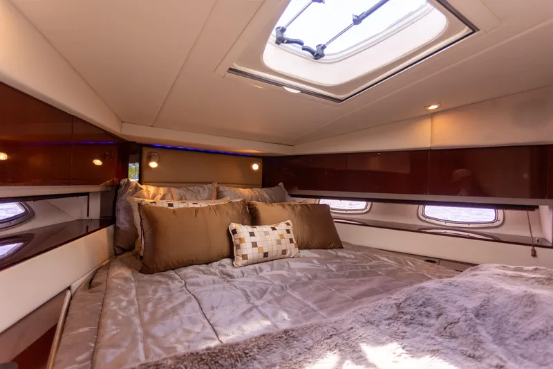 Slide: The Image of Luxurious cabin interior of 2011 Sea Ray 450 Sundancer yacht with plush bedding. - 38