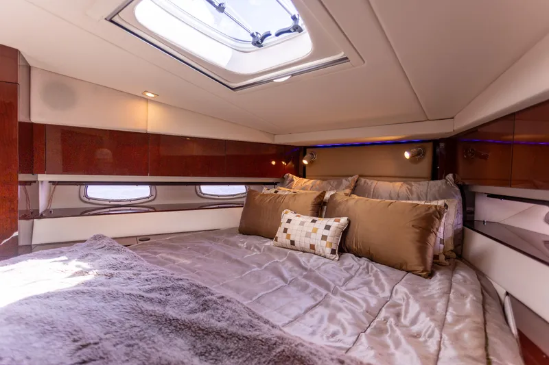 Slide: The Image of Luxurious cabin interior of 2011 Sea Ray 450 Sundancer yacht with plush bedding. - 39