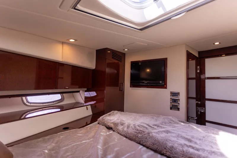 Slide: The Image of Luxurious cabin interior of 2011 Sea Ray 450 Sundancer yacht with TV and skylight. - 40