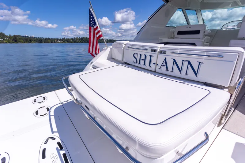 Slide: The Image of 2011 Sea Ray 450 Sundancer yacht with American flag on a sunny day. - 7