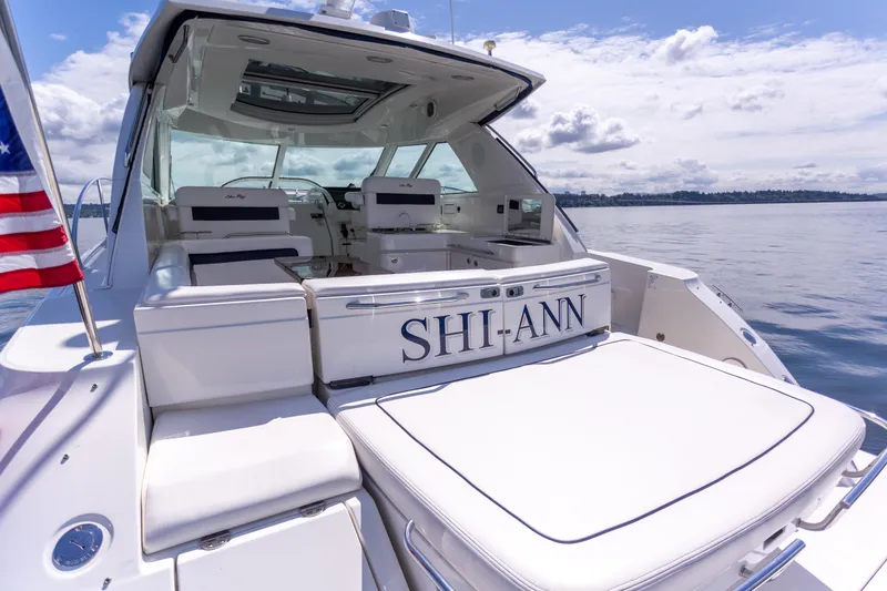 Slide: The Image of 2011 Sea Ray 450 Sundancer yacht on water, featuring spacious deck and elegant design. - 8