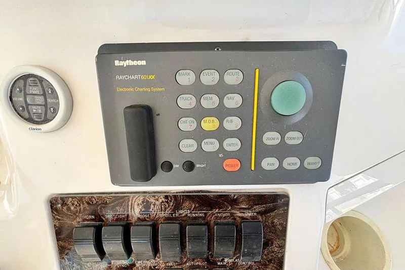Slide: The Image of Control panel of a 1998 Sea Ray 480 Sedan Bridge with Raytheon electronic charting system. - 17