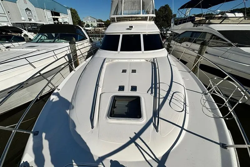 Slide: The Image of 1998 Sea Ray 480 Sedan Bridge yacht docked at marina. - 38