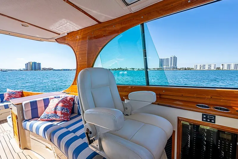 Slide: The Image of 2016 Hinckley Picnic Boat MKIII interior with luxurious seating and ocean view. - 11