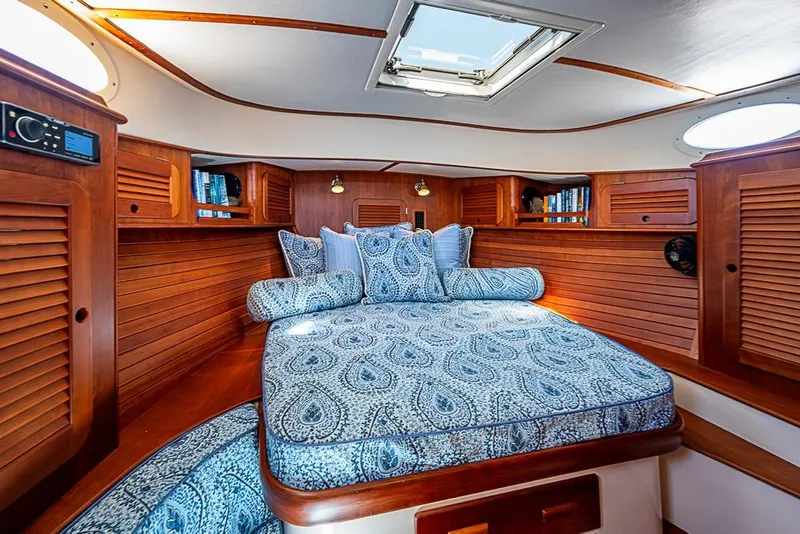 Slide: The Image of Luxurious cabin interior of 2016 Hinckley Picnic Boat MKIII with elegant wood finish. - 17