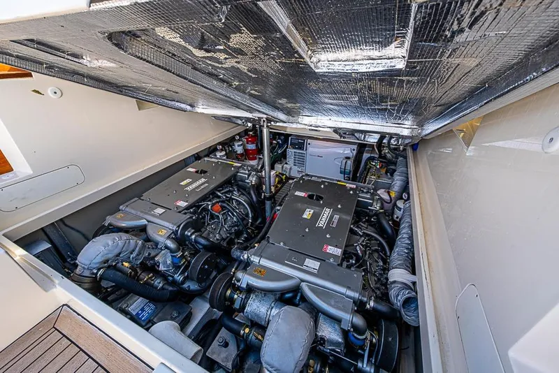 Slide: The Image of Engine compartment of 2016 Hinckley Picnic Boat MKIII, showcasing dual engines and mechanical components. - 22