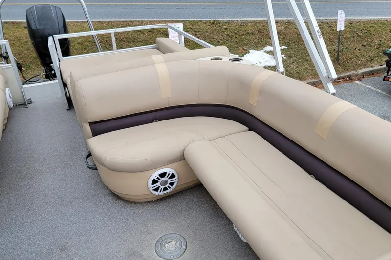 Slide: The Image of 2017 Sun Tracker Party Barge 24 DLX with beige seating and speaker system. - 6