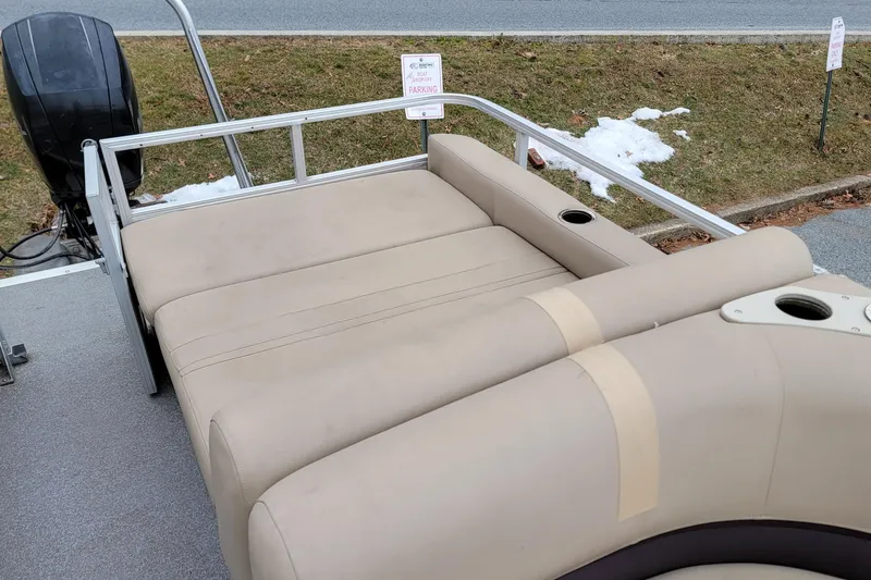 Slide: The Image of 2017 Sun Tracker Party Barge 24 DLX with beige seating and cup holders. - 7