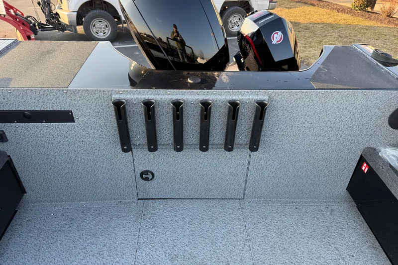 Slide: The Image of 2026 Crestliner 1850 Commander Elite boat interior with rod holders and Mercury engine. - 13