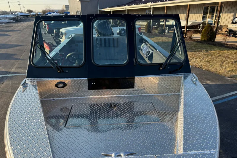 Slide: The Image of 2026 Crestliner 1850 Commander Elite boat with diamond plate deck and windshield wipers. - 5