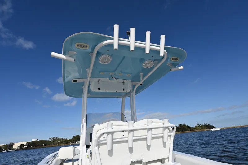 Slide: The Image of 2016 Sea Hunt Ultra 235 SE boat with T-top on a sunny day. - 14