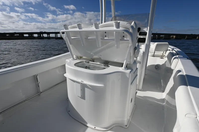 Slide: The Image of 2016 Sea Hunt Ultra 235 SE boat interior with open storage compartment. - 15