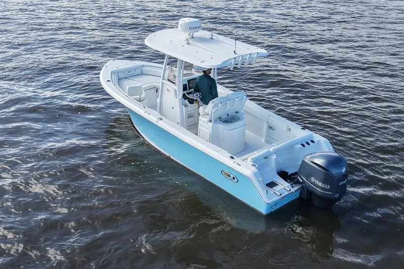 Slide: The Image of 2016 Sea Hunt Ultra 235 SE boat on water, featuring Yamaha engine. - 4