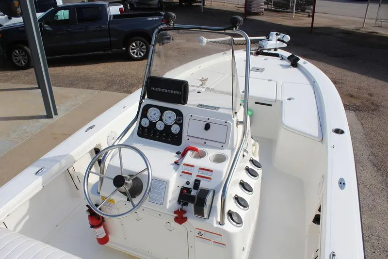 Slide: The Image of Kenner 2201 boat interior, 2009 model, featuring steering wheel and control panel. - 13