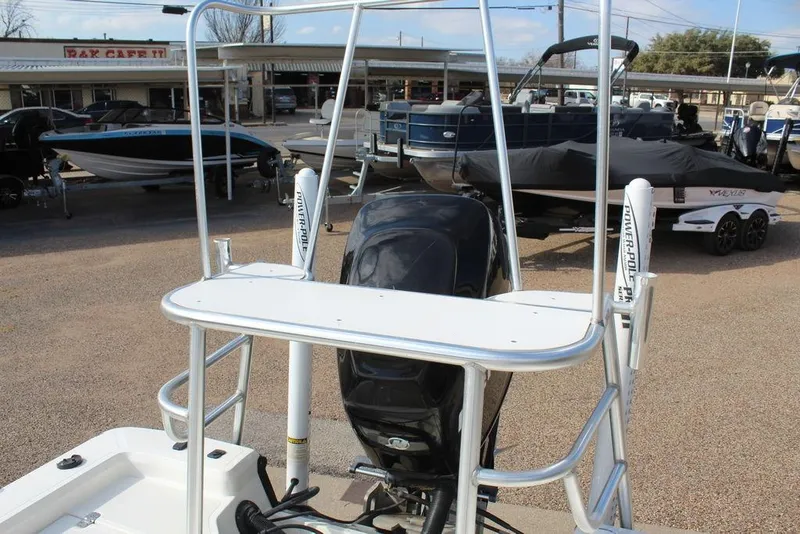 Slide: The Image of Kenner 2201 boat, 2009 model, with Power-Pole anchors, displayed in a marina setting. - 15