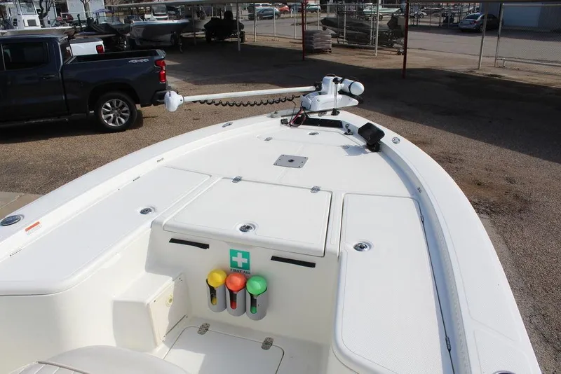 Slide: The Image of 2009 Kenner 2201 boat deck with storage compartments and trolling motor. - 16
