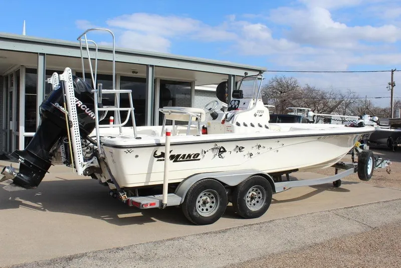 Slide: The Image of Kenner 2201 boat on trailer, 2009 model, with Mercury outboard motor. - 3