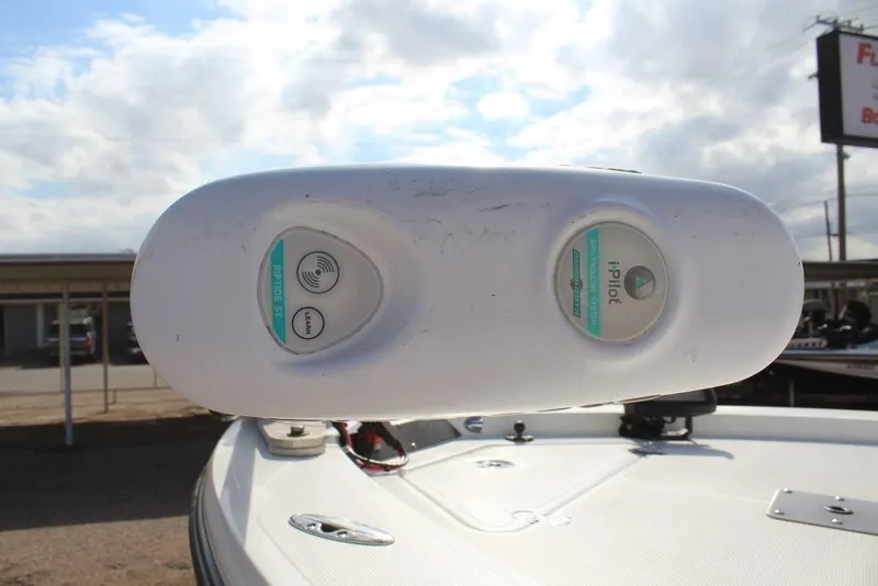 Slide: The Image of Kenner 2201 boat with iPilot trolling motor, 2009 model, under a cloudy sky. - 8