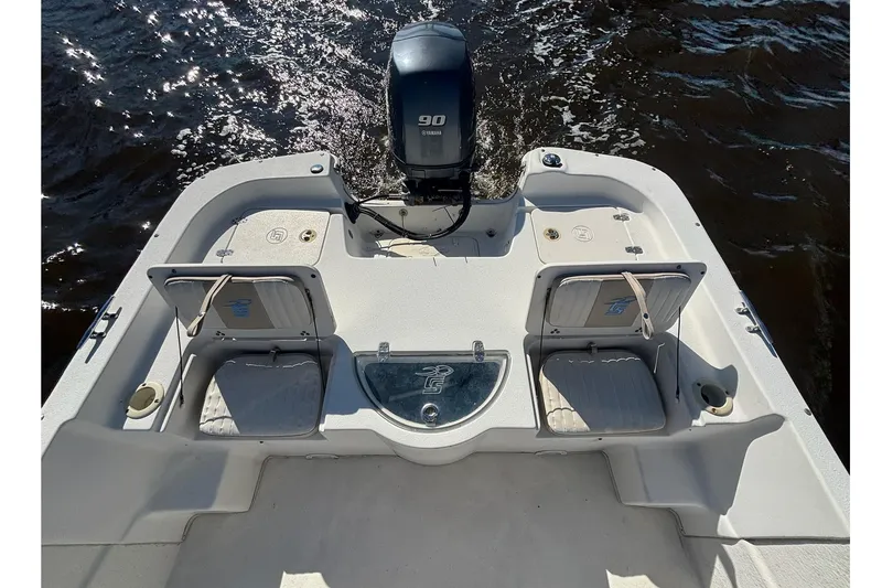 Slide: The Image of 2016 Carolina Skiff 198 DLV boat with outboard motor on water. - 11