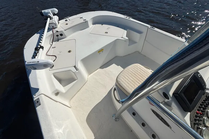 Slide: The Image of 2016 Carolina Skiff 198 DLV boat interior with trolling motor and seating. - 7
