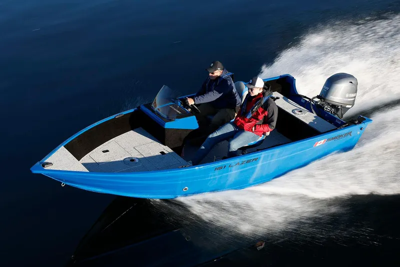 Slide: The Image of Manufacturer Provided Image: 2026 Smoker Craft Lazer 161 boat on the water. - 2