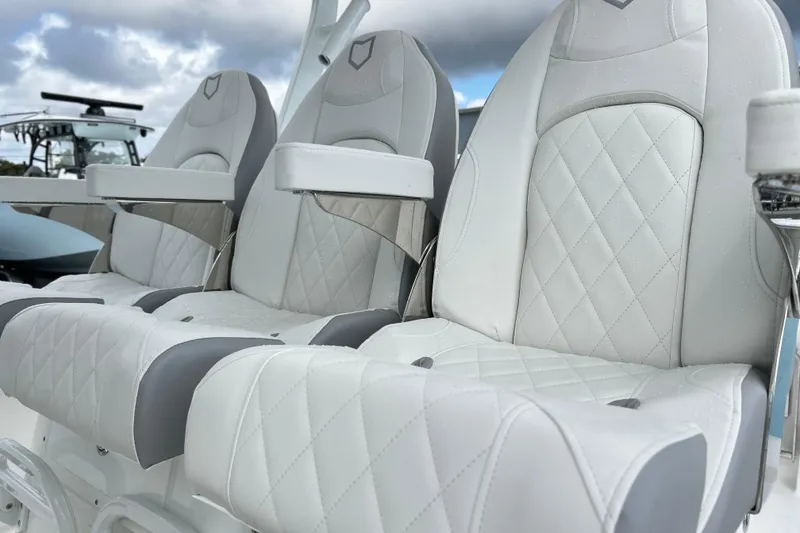 Slide: The Image of Luxury seating on 2026 Sea Fox 328 Commander boat, featuring elegant white upholstery. - 10