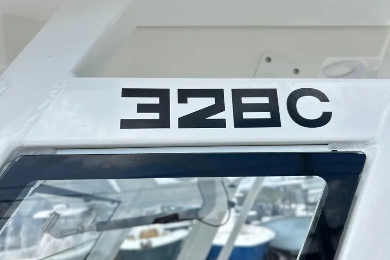 Slide: The Image of 2026 Sea Fox 328 Commander boat model name on white surface. - 11