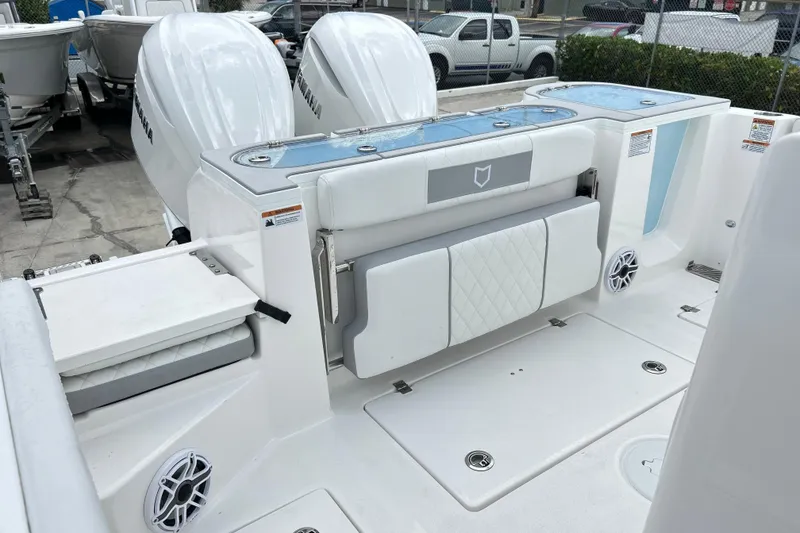 Slide: The Image of 2026 Sea Fox 328 Commander boat interior with Yamaha engines and seating area. - 13