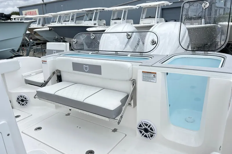 Slide: The Image of 2026 Sea Fox 328 Commander boat interior with seating and storage compartments. - 15