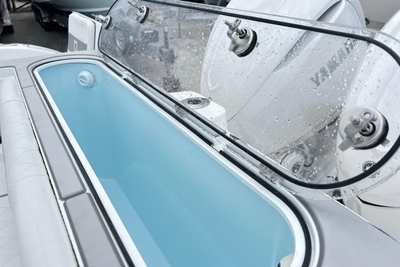 Slide: The Image of Livewell on 2026 Sea Fox 328 Commander boat with Yamaha engines in background. - 17