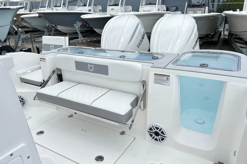 Slide: The Image of 2026 Sea Fox 328 Commander boat interior with seating and storage compartments. - 18