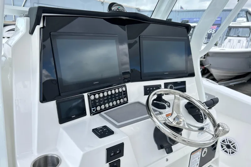 Slide: The Image of Helm of 2026 Sea Fox 328 Commander with dual displays and modern controls. - 2