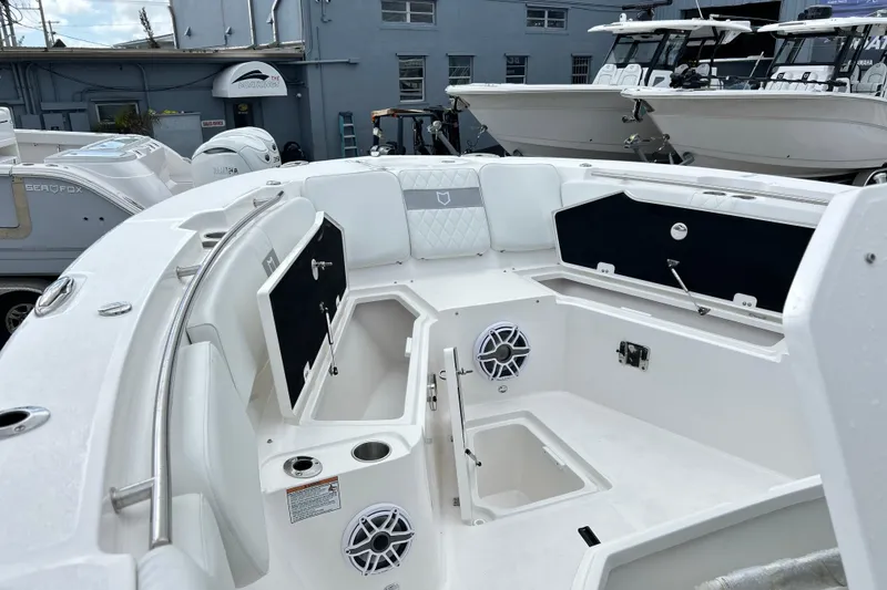 Slide: The Image of 2026 Sea Fox 328 Commander boat interior with storage compartments and speakers. - 29