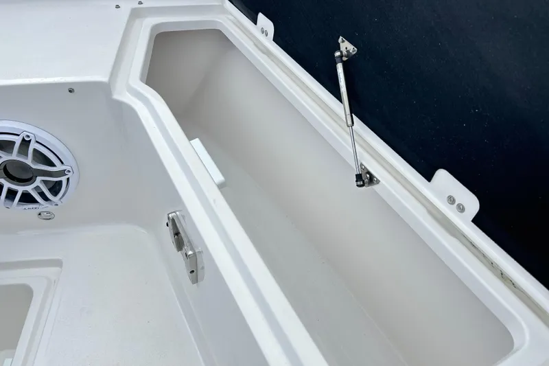Slide: The Image of 2026 Sea Fox 328 Commander storage compartment with speaker and hydraulic lift. - 31