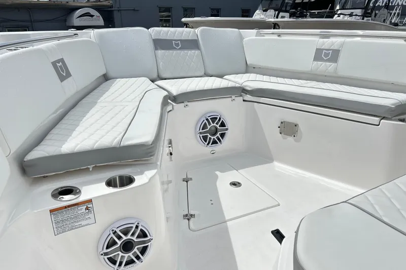 Slide: The Image of Interior of 2026 Sea Fox 328 Commander boat with cushioned seating and speakers. - 34
