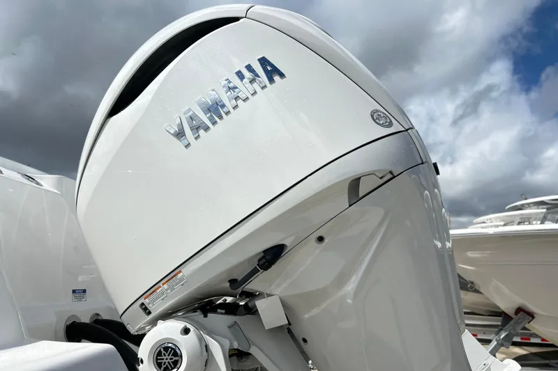 Slide: The Image of Yamaha outboard motor on 2026 Sea Fox 328 Commander under cloudy sky. - 44